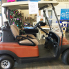 Orange two seater golf cart