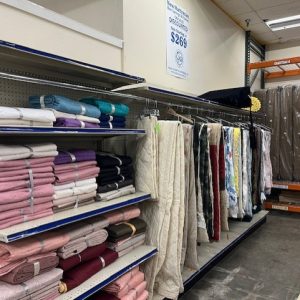 Colorful linen on shelf and hanging